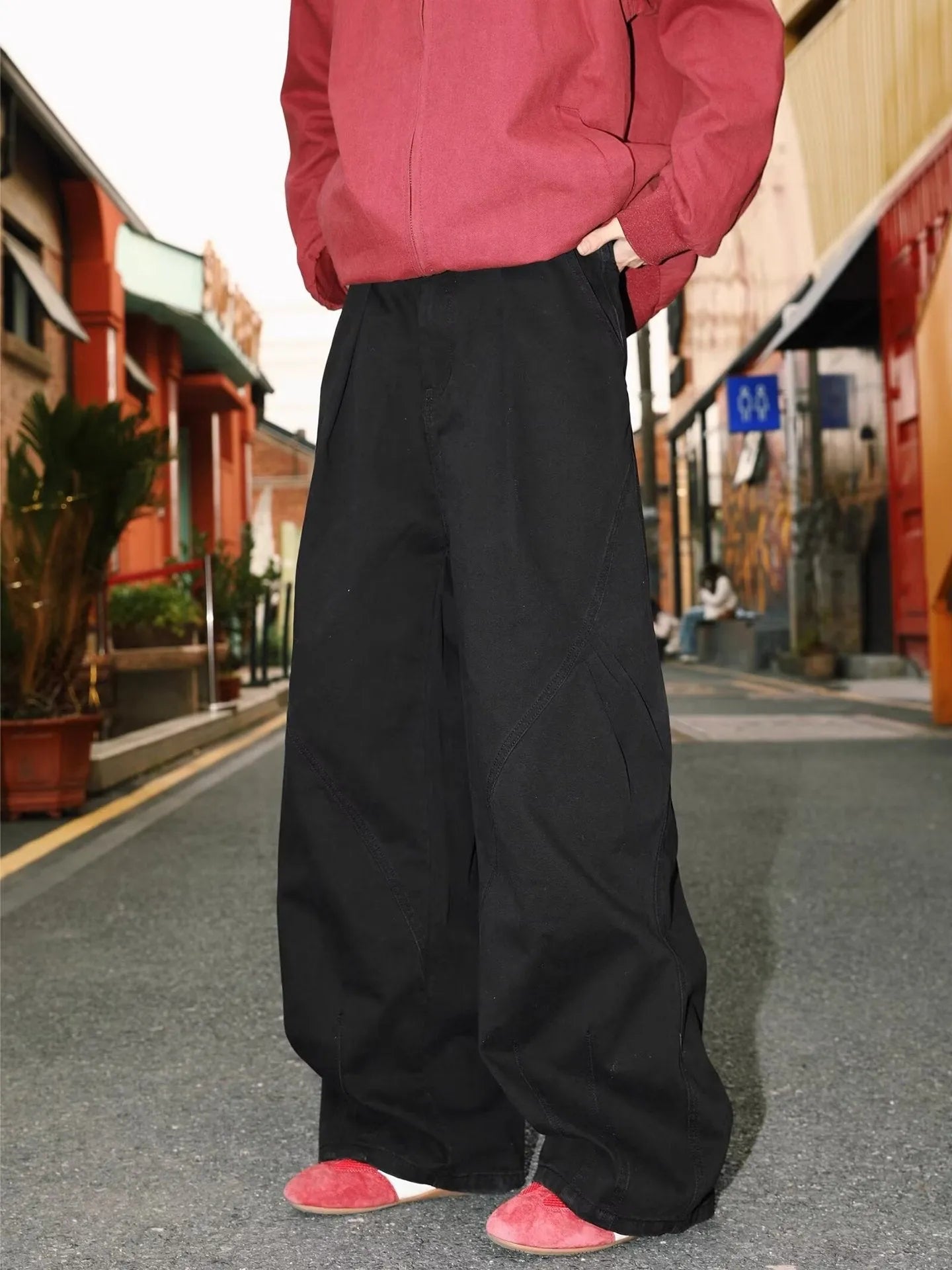 Man wearing pleated straight-leg trousers in a striped pattern with a micro elastic mid waist.