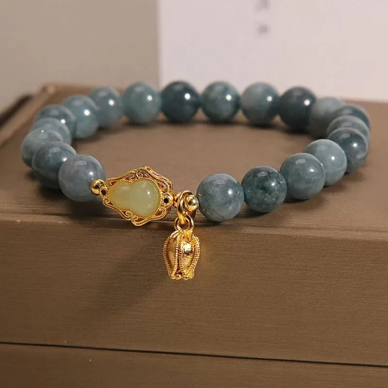 Natural stone bracelet for women featuring a sky blue gourd and lotus pendant, made from real stone with electroplating treatment, a detailed floral shape jewellery piece ideal for everyday wear and accessory layering