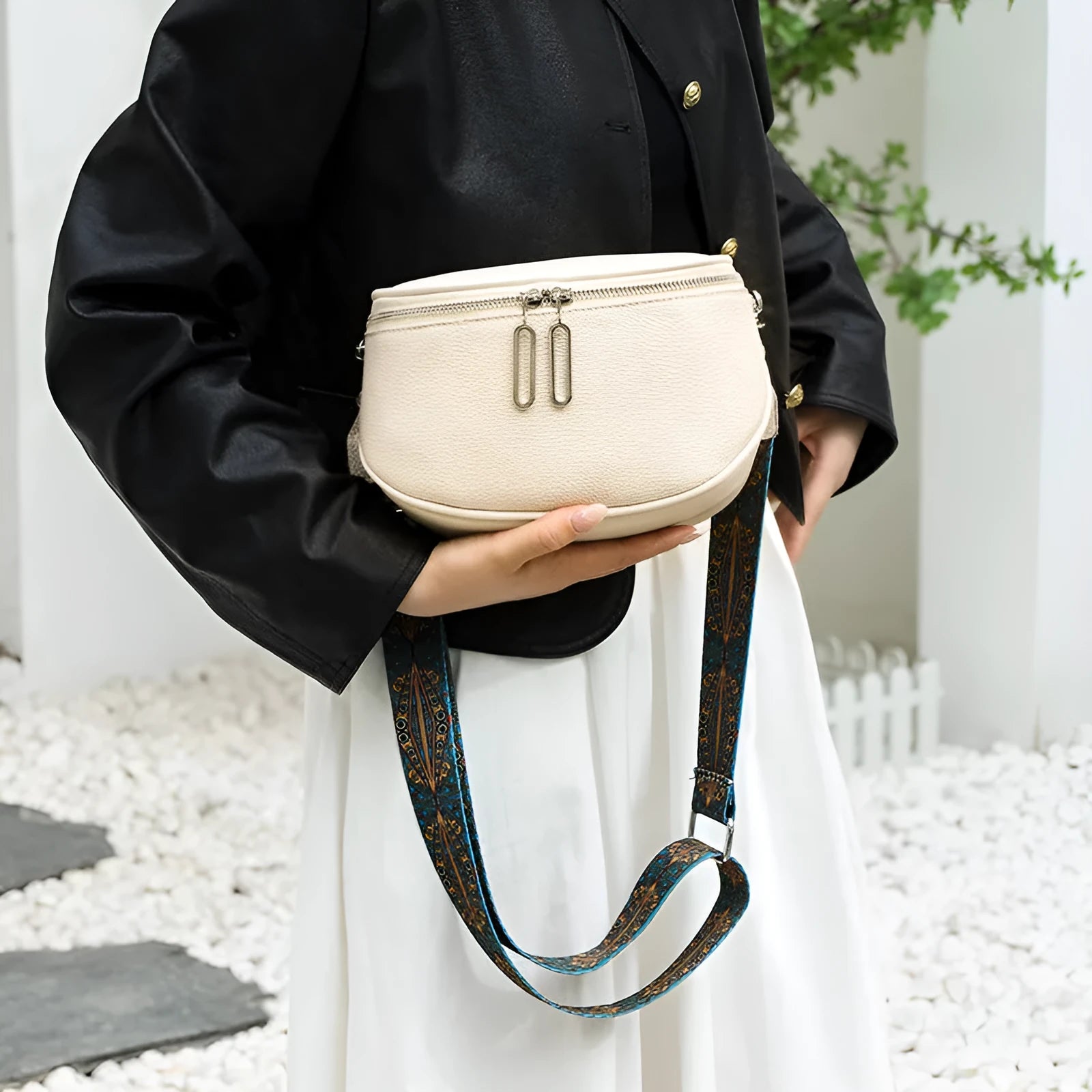 Women's soft PU leather messenger bag in saddle shape with a cross-body strap.