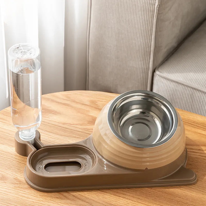 Brown elevated pet feeding bowl with attached water bottle for cats and small dogs on a wooden floor.
