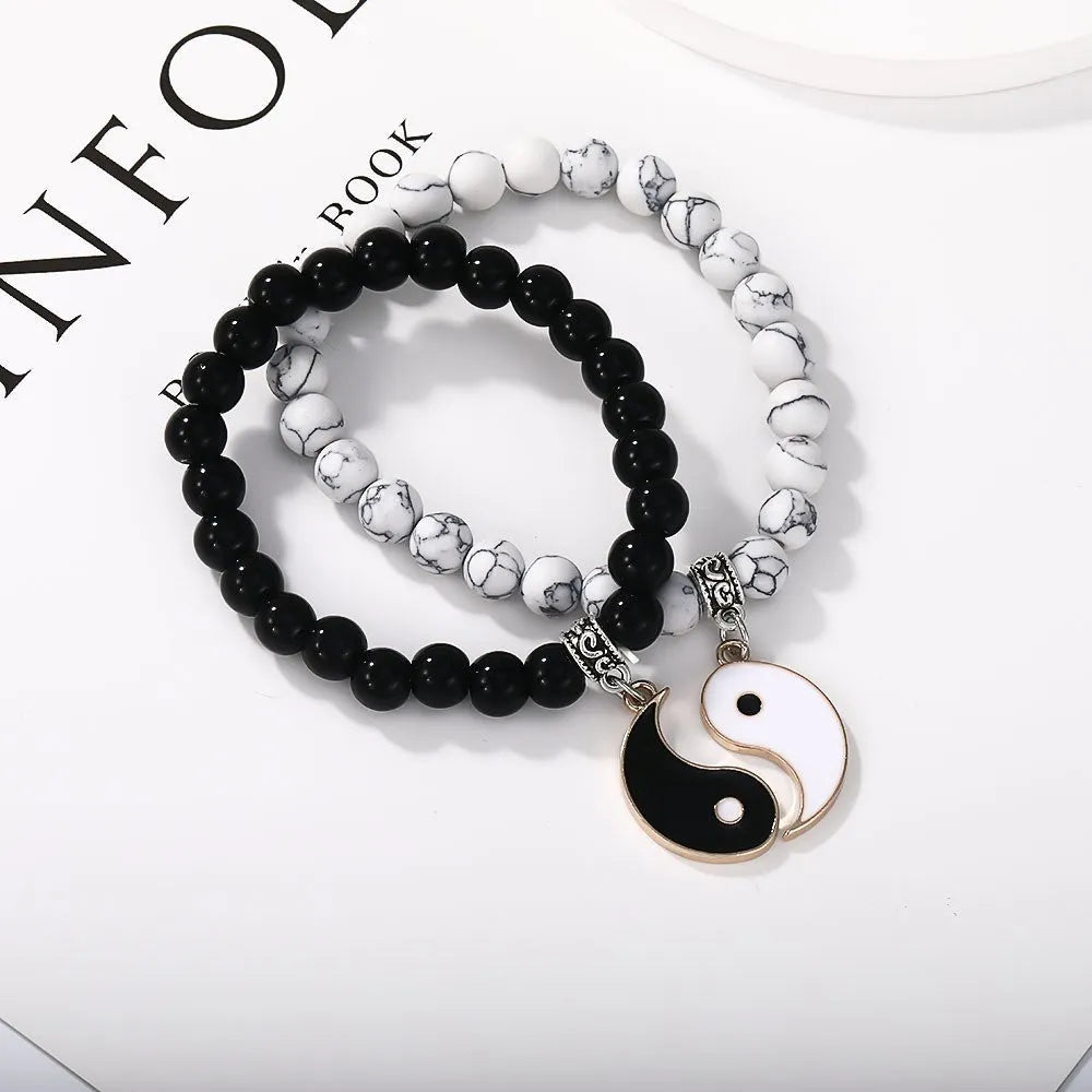 Geometric eight-diagram shaped alloy bracelet with an electroplated finish in a unisex design.