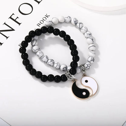 Geometric eight-diagram shaped alloy bracelet with an electroplated finish in a unisex design.