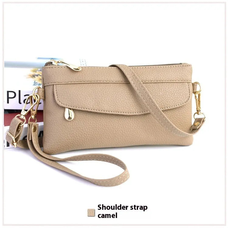 Soft surface square PU crossbody bag and clutch with internal zipper pocket in various colours.