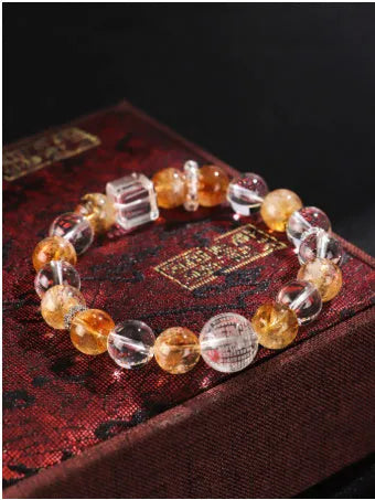 Handmade women's crystal beaded bracelet with freshwater pearls and small Buddha charm