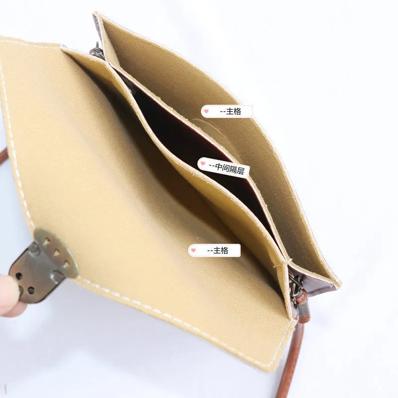 Retro shoulder messenger bag in cross square shape with flap and lock closure, showing internal mobile phone compartment