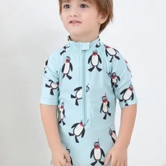Boy's penguin-print long sleeve swimsuit with matching swimming cap for sun protection