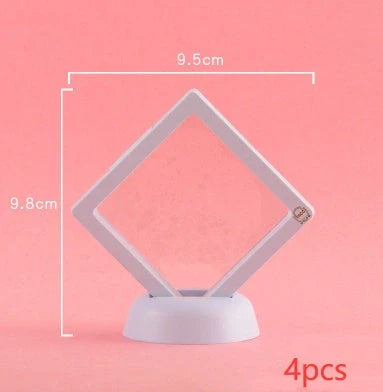 3D floating jewelry coin display stand in white and black, showcasing collectibles in mid-air