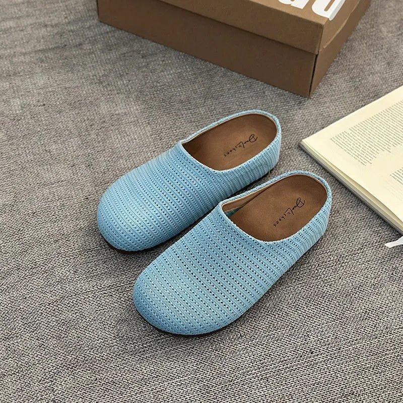 Baotou Boken women's cloth upper slippers with rubber sole in beige, shown in a leisure setting.