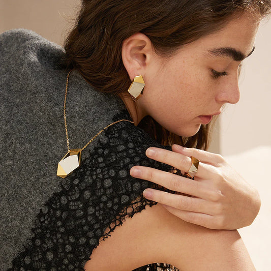 18K gold brass ring with a meteorite-inspired design, showcasing a unique and sophisticated accessory
