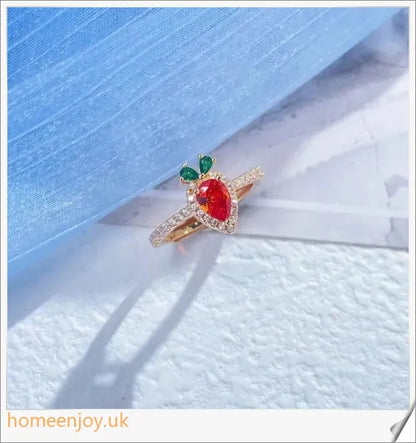 A close-up image of a copper ring with a whimsical carrot-shaped design and micro-inlaid details, showcasing a playful and charming accessory.