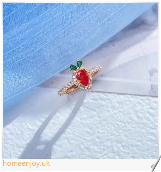 A close-up image of a copper ring with a whimsical carrot-shaped design and micro-inlaid details, showcasing a playful and charming accessory.