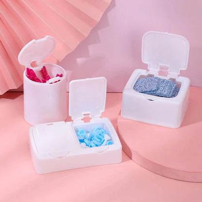 Three white plastic storage boxes for organising eyelash extension tools and accessories