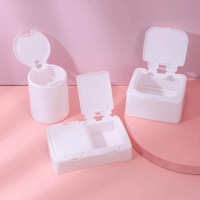 Three white plastic storage boxes for organising eyelash extension tools and accessories