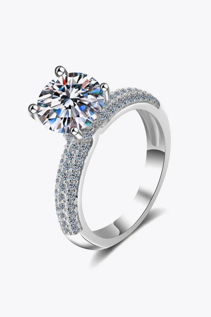 Elegant 4-prong moissanite and sterling silver ring with rhodium plating and zircon accent stones
