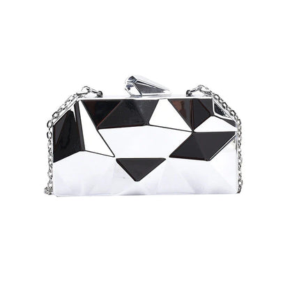 Elegant black leather handbag with a shimmering diamond-inspired chain strap, a timeless accessory for the modern British fashionista.