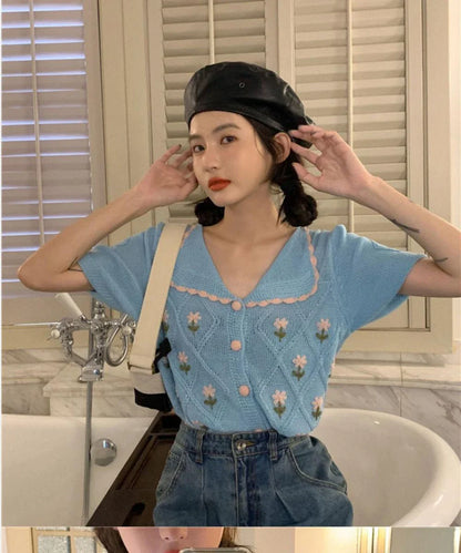 French-inspired short-sleeved cardigan with embroidered details in summer yellow and sky blue colours