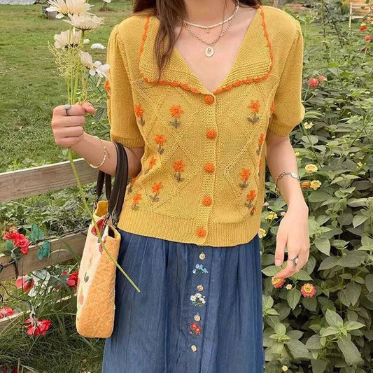 French-inspired short-sleeved cardigan with embroidered details in summer yellow and sky blue colours