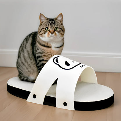 White slipper-style corrugated paper cat scratch board on a floor