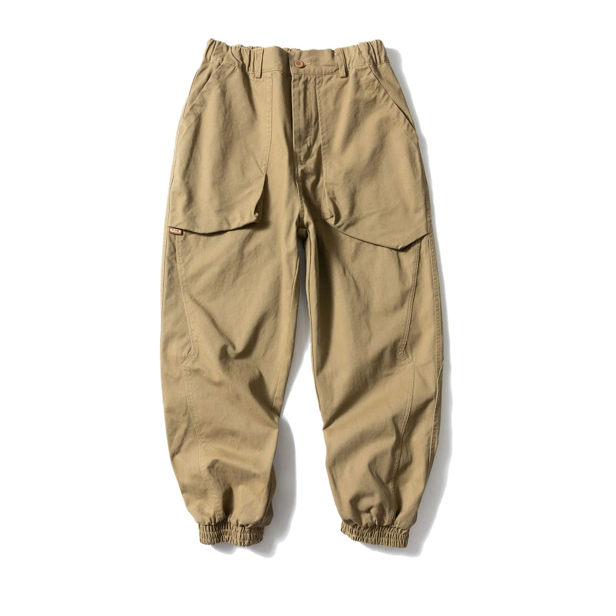 Solid colour cotton casual pants with large pockets and a tapered, ankle-tied silhouette.