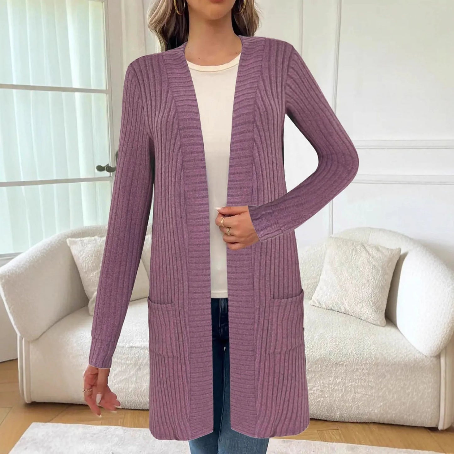 Long sleeve loose fit knitted cardigan jacket with side pockets, shown in grey.
