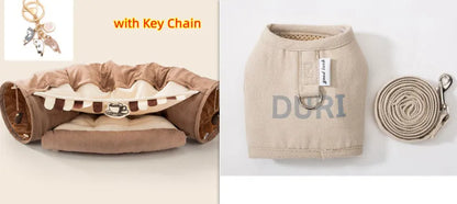 Collapsible cloth cat tunnel in pink colour, shown in both open and folded positions.