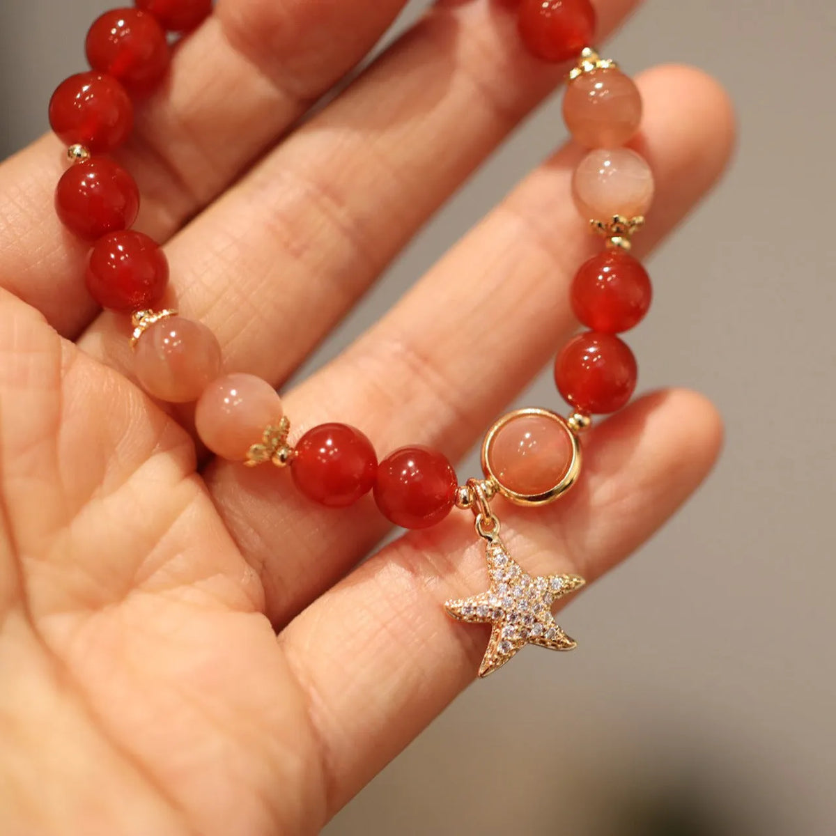Handmade red agate and sunstone ethnic bracelet with star and Xiangyun designs for women