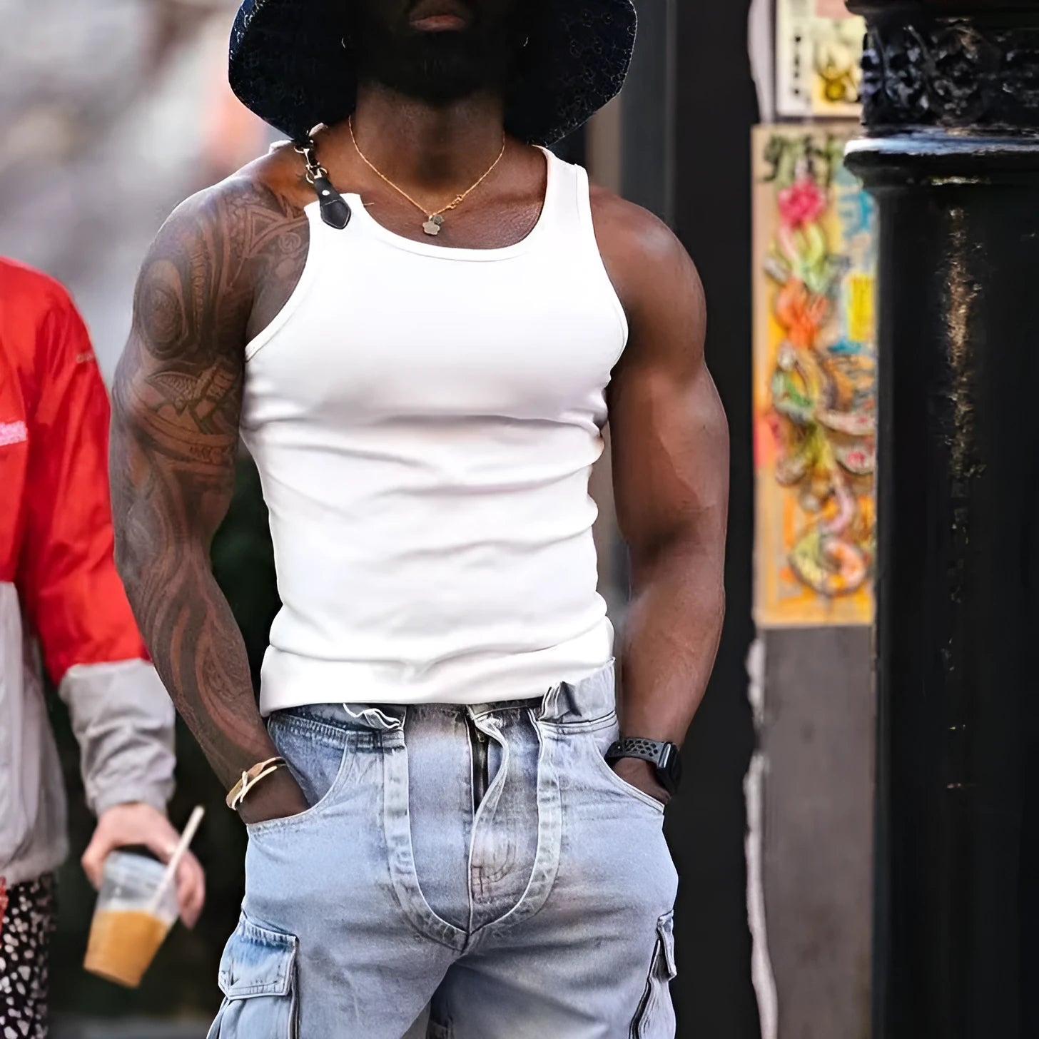 A sleeveless tight-fit vest in a solid colour, shown in either white or black.
