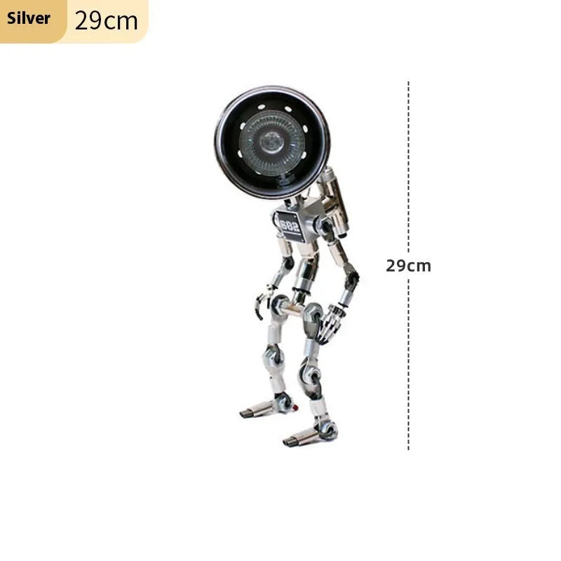 Silver copper robot-shaped decorative desk lamp with custom graphic option on a wooden shelf.