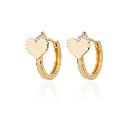 Simple zircon love heart shaped stud earrings for women in titanium steel with 18K finish.