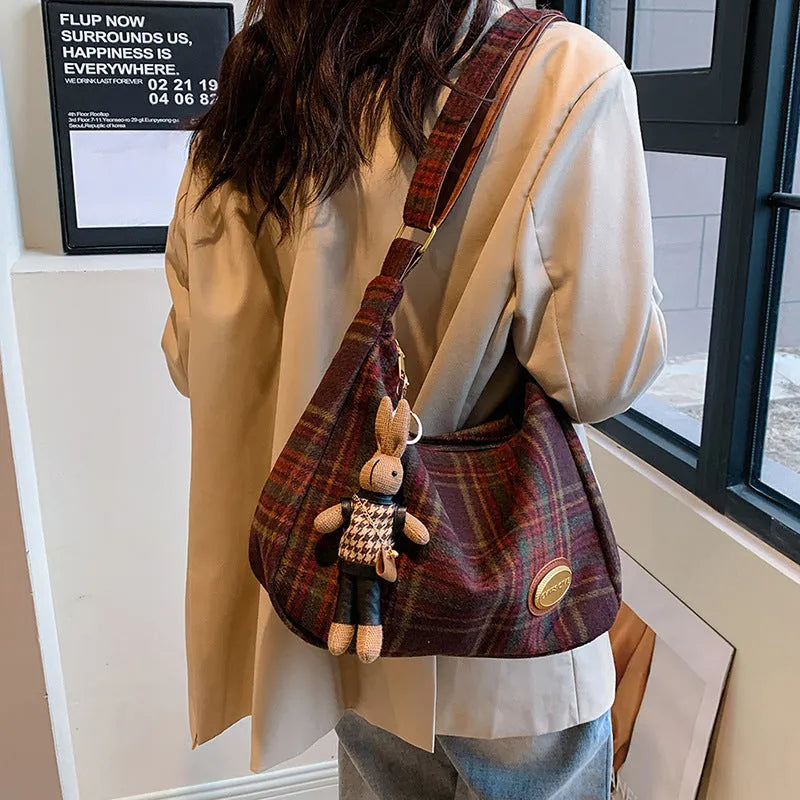 Women's large capacity woolen shoulder bag in brown with pendant attachment for autumn and winter use
