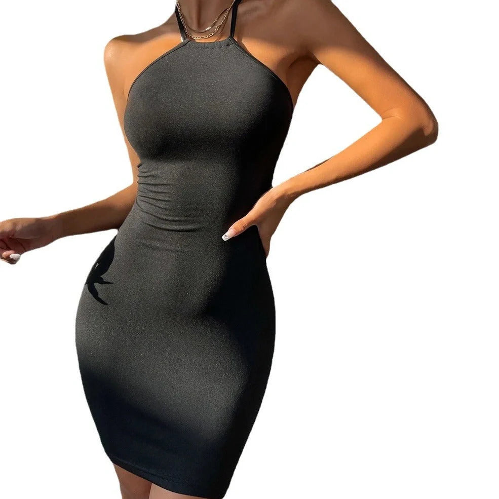 Black backless pencil skirt with lace-up detailing at back, wrap skirt construction, sleeveless design