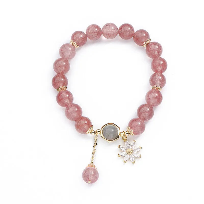 Korean Mori style crystal bracelet with a strawberry quartz bead and floral electroplated metal details