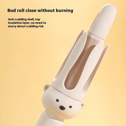 Beige automatic hair curler machine with negative ion technology and included styling stick on a table.