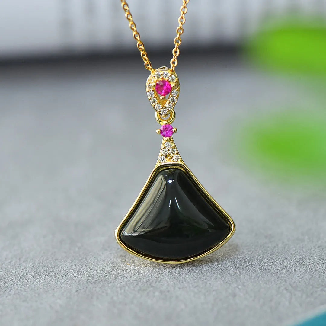 Copper inlaid pendant with natural grey Hetian jade and dark ink blue jade on a necklace.