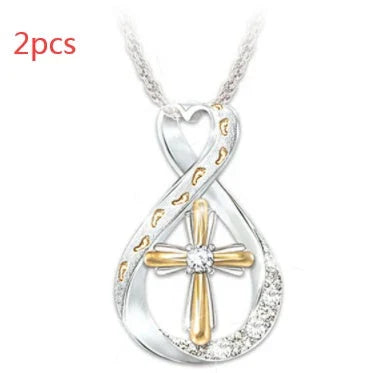 Elegant two-tone cross pendant with sparkling accent, featuring a captivating geometric design and adjustable chain