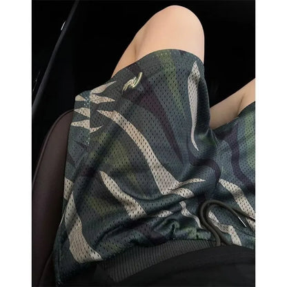 Men's camouflage patterned straight-leg mesh shorts laid flat, showing cotton blend fabric and relaxed fit.