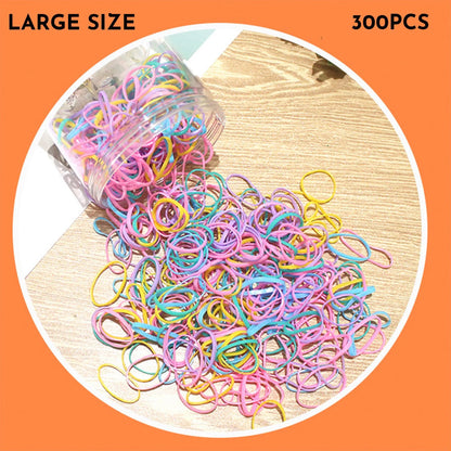 Assorted colourful thin TPU baby hair ties for toddlers and kids in a reusable plastic storage container.