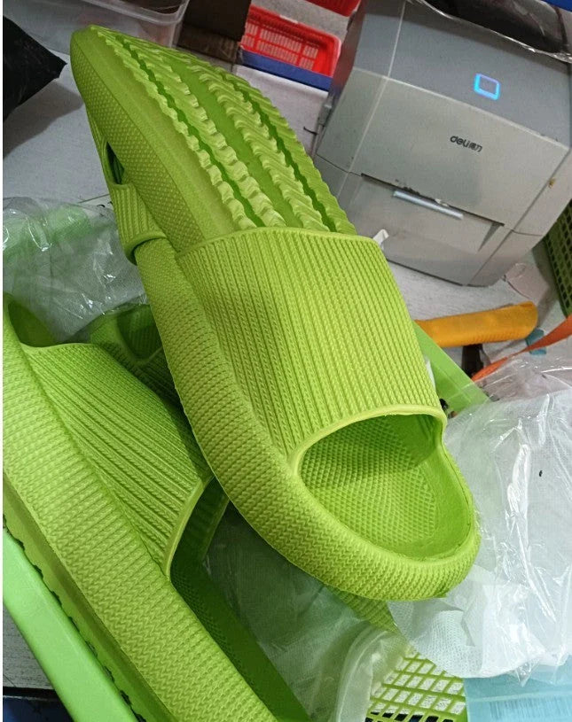 Cozy slip-on slippers in various colors for men and women, featuring soft fabric upper and non-slip EVA soles