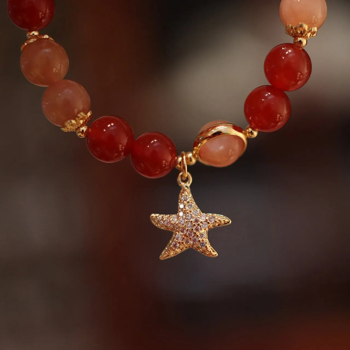 Handmade red agate and sunstone ethnic bracelet with star and Xiangyun designs for women