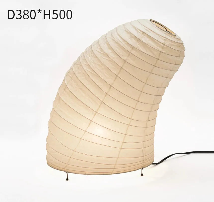 Japanese style table lamp with a white handmade rice paper shade on a slim aluminium base.
