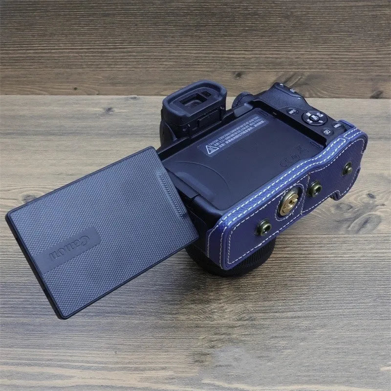 PU shoulder bag for a single mirrorless camera, shown in oil skin or palm print finish