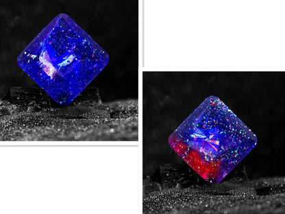 Galactic edition pocket gyro desk toy on a surface, showing its quadrilateral resin construction and celestial colour design.