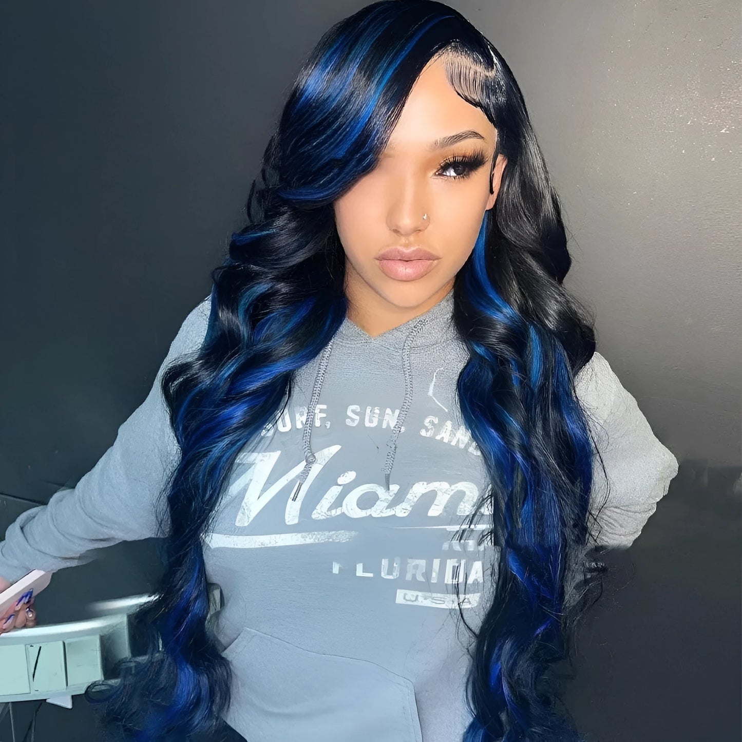 A woman wearing a long, real human hair lace front wig with a natural-looking 4x4 HD lace hairline.