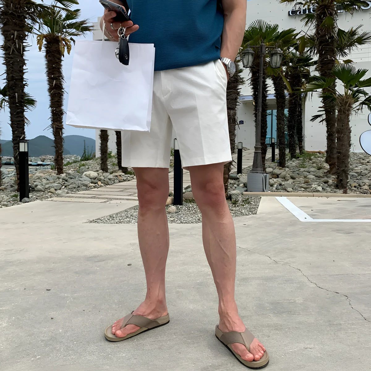 Men's loose straight casual shorts in black, khaki, and white solid colours.