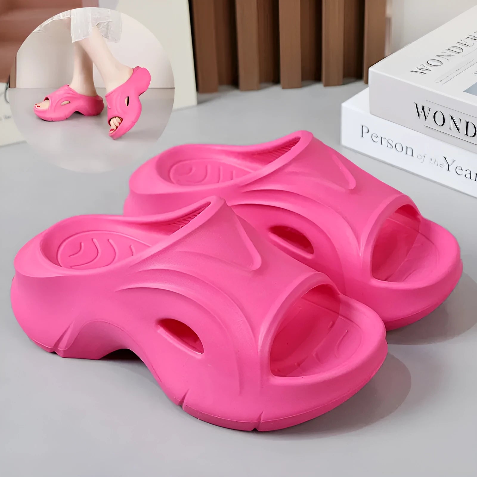 Women's white thick-soled EVA slippers with a round toe on a beach background.