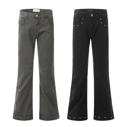 A pair of black straight-leg cotton jeans with a mid-waist fit and horn-style leg opening on a plain background.