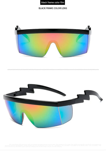 Black one-piece cycling sunglasses with blue polycarbonate lenses and lightning leg temples on a grey background.