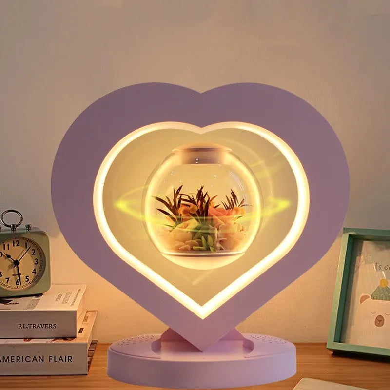 Pink preserved rose ornament with Bluetooth speaker and LED light on wooden table
