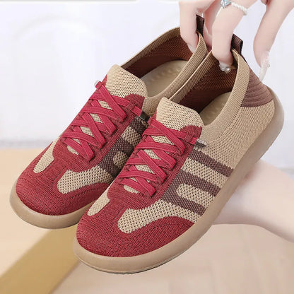 Retro style casual training shoes in flyknit mesh with a soft PU sole and flat heel.