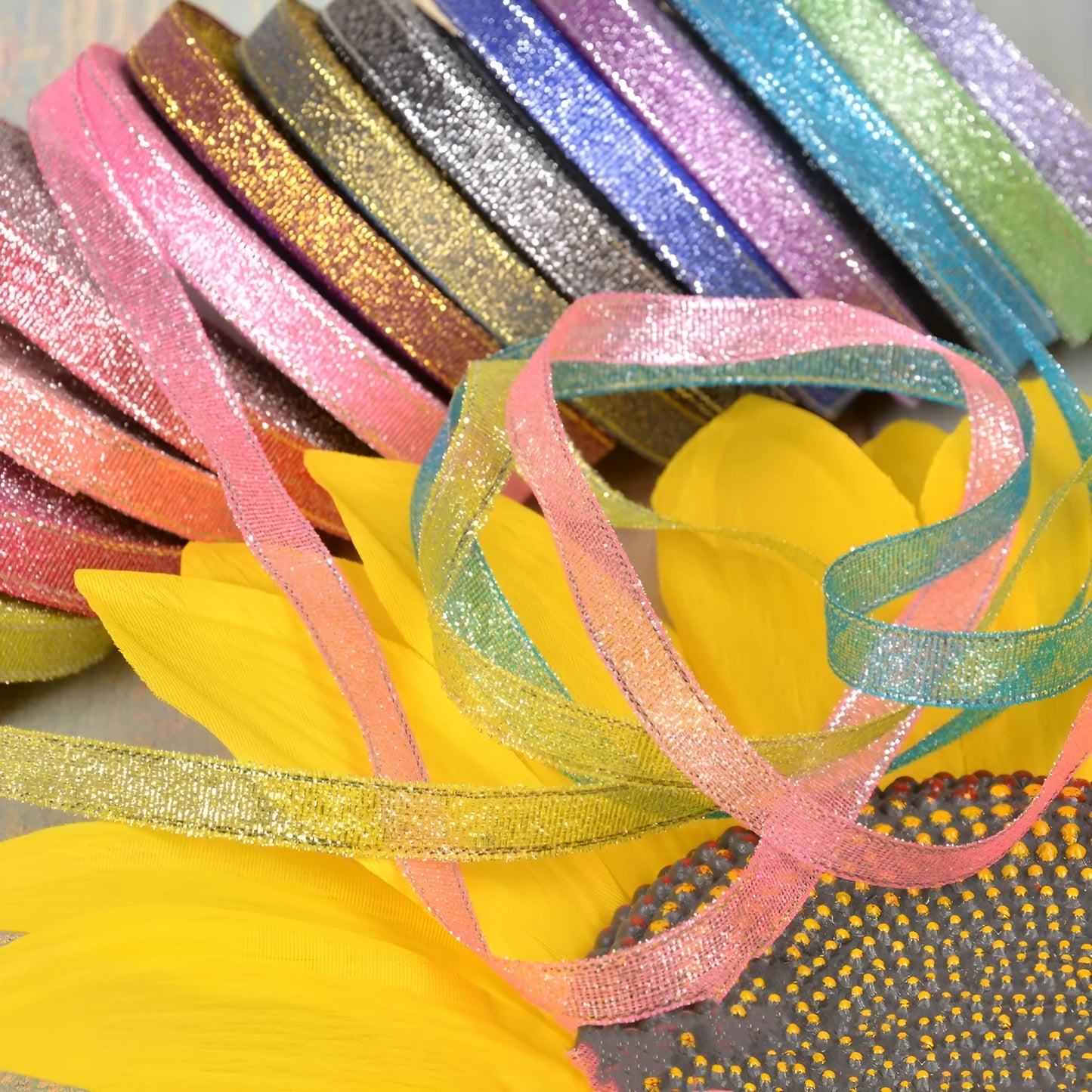 Close-up of green onion patterned ribbon with gold wire on a 25-yard roll, showing 3-points width.